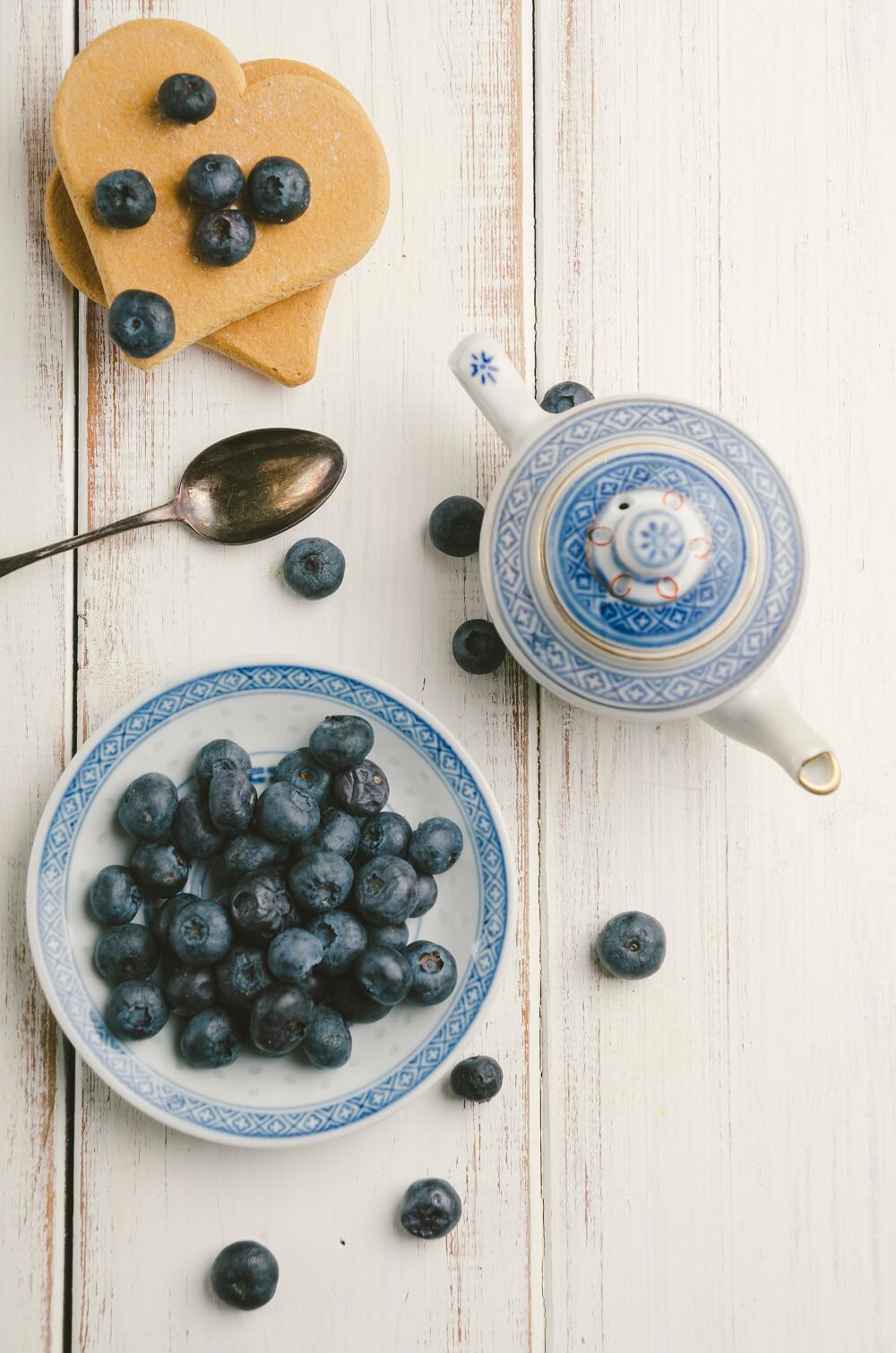 Blueberries on rustic white wooden table