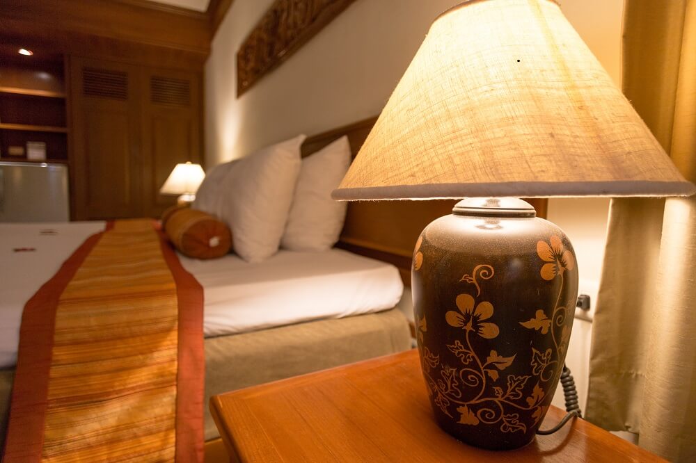 Lamp in a hotel bedroom interior design