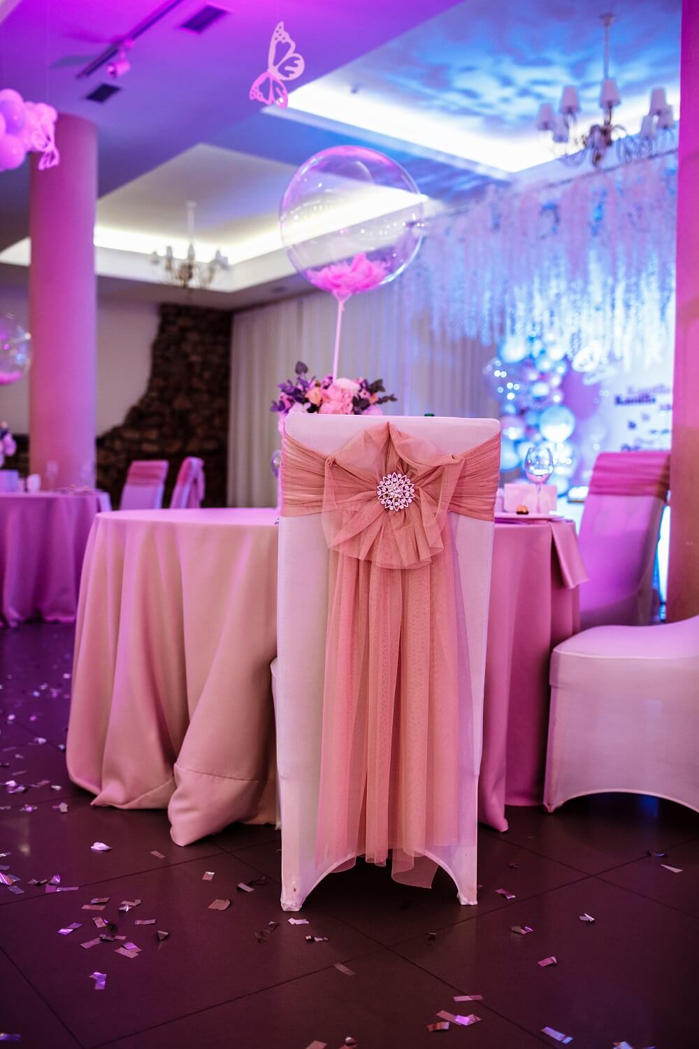 The chairs with bows and jewerly in the resturant on wedding day.