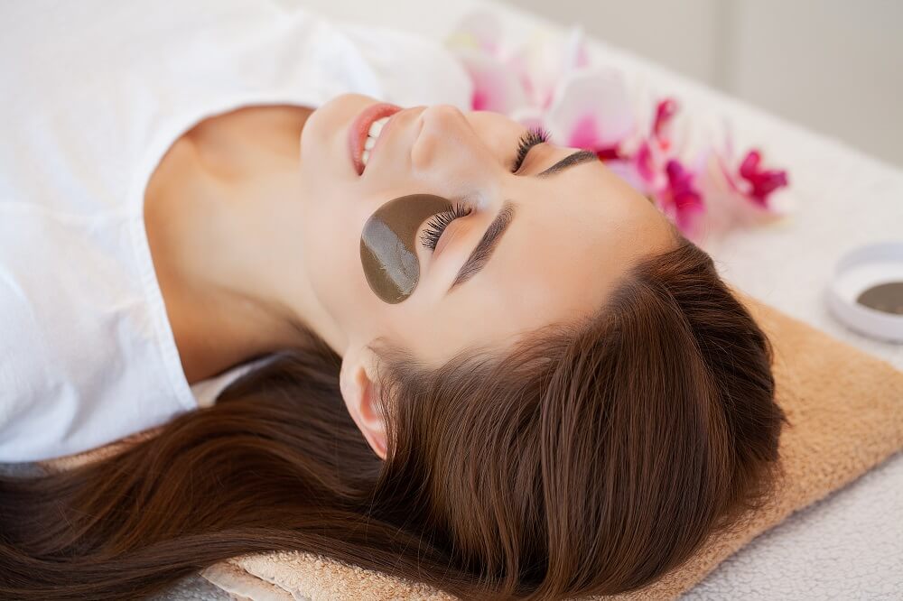 Woman With Eye Patches, Relaxing In Spa Center.